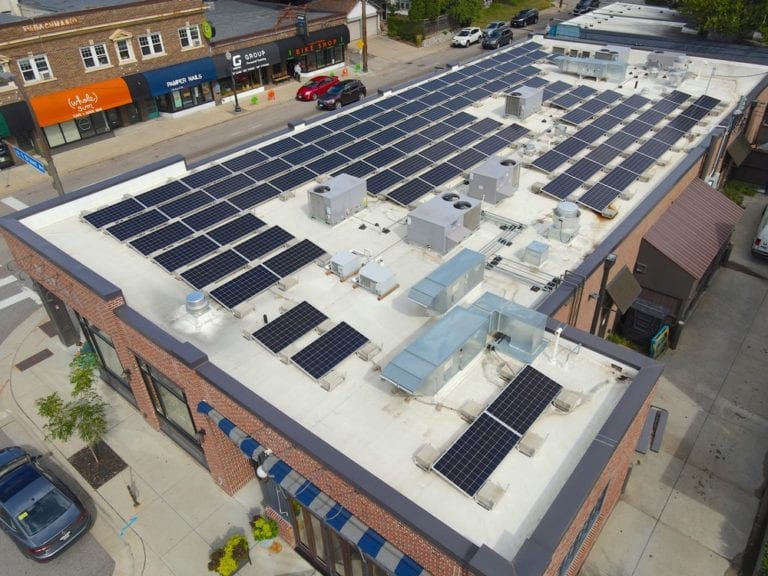 Tilted solar panels on a flat roof for a commercial building in Minneapolis