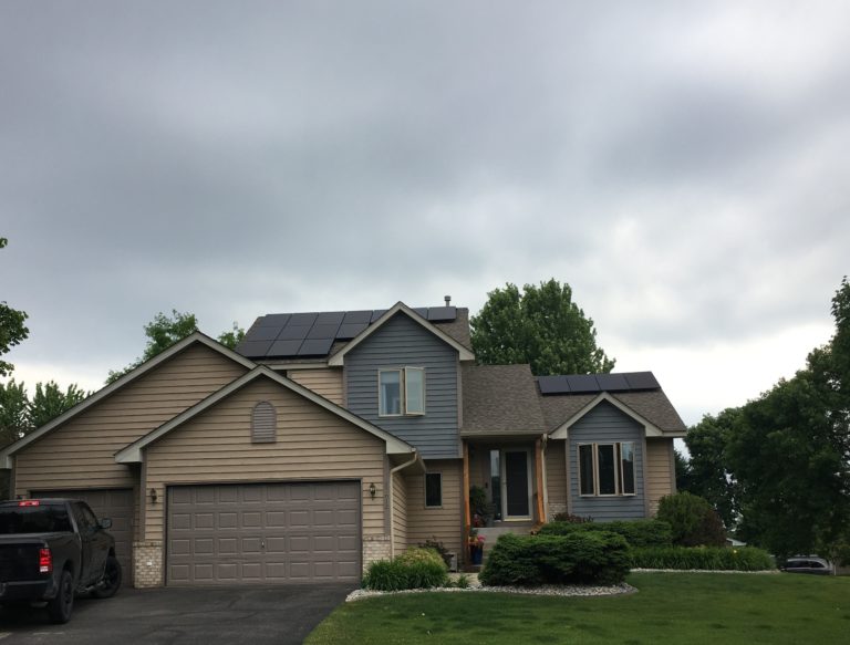 Solar panels on two separate roof surfaces in Farmington, Minnesota.