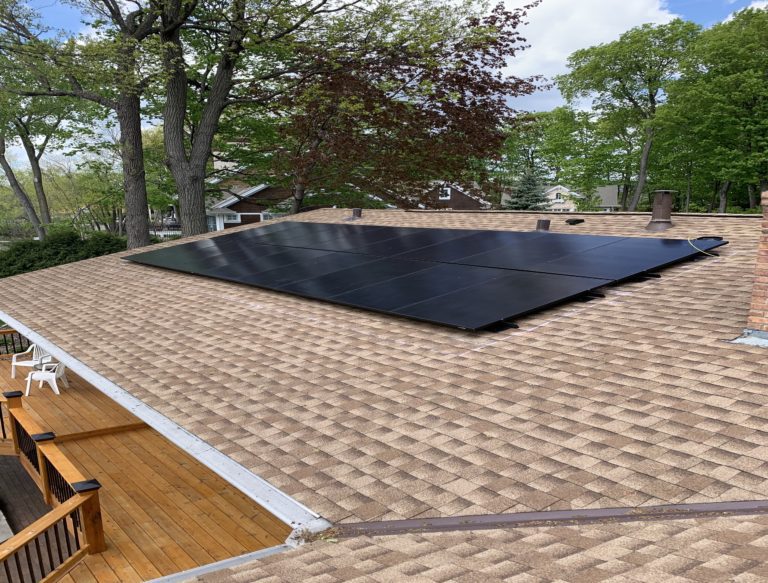16 solar panels on residential tan roof.