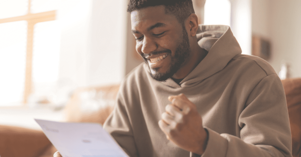 homeowner reviewing lower energy bill after installing solar panels