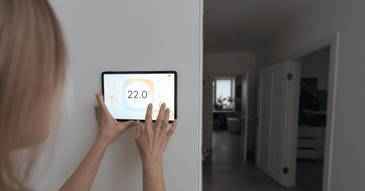 Minneapolis Homeowner viewing home energy management dashboard on smart panel